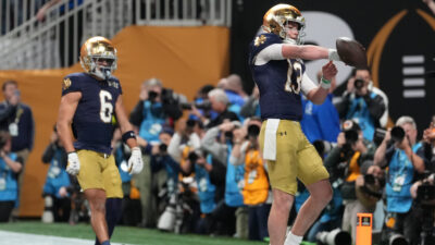Riley Leonard scores a touchdown on Notre Dame's opening drive.