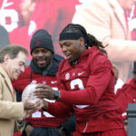 Nick Saban and Derrick Henry celebrate.