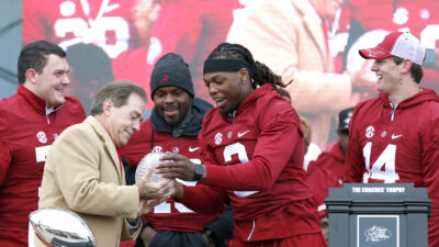 Nick Saban and Derrick Henry celebrate.