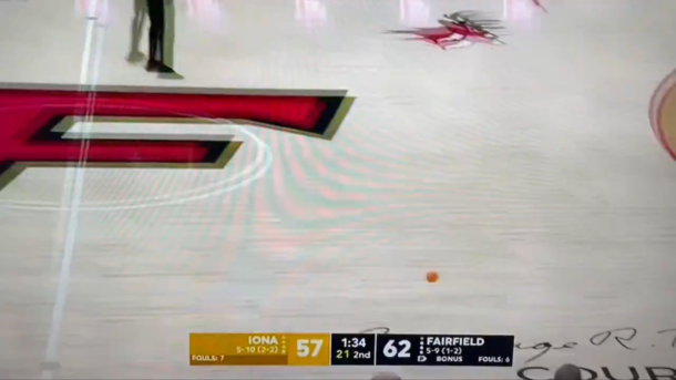 College basketball game halted by kids hilariously throwing mini basketballs