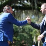 Tim Tebow and Dan Mullen shown embracing.