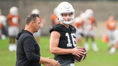 Texas head coach Steve Sarkisian and Arch Manning at practice.