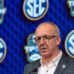 SEC Commissioner Greg Sankey at the podium.