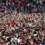Oklahoma fans rushed the field after beating Alabama in 2024.