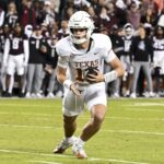 Arch Manning runs the ball vs. Texas A&M in 2024.