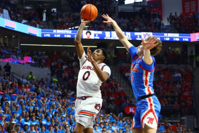 Auburn and Ole Miss players in action.