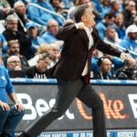 John Calipari celebrates after a big play in Arkansas's win over Kentucky.