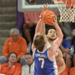 Clemson's Chase Hunter blocks a shot by Duke's Kon Knueppel.