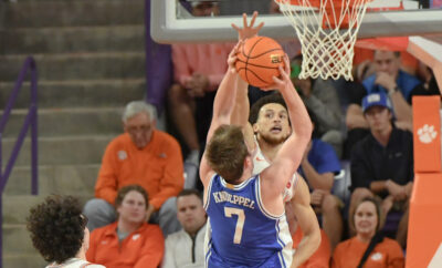 Clemson's Chase Hunter blocks a shot by Duke's Kon Knueppel.