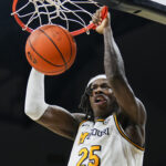 Mizzou forward Mark Mitchell dunks the ball.