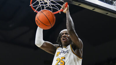 Mizzou forward Mark Mitchell dunks the ball.