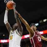 Mark Mitchell attempts a shot against Oklahoma.