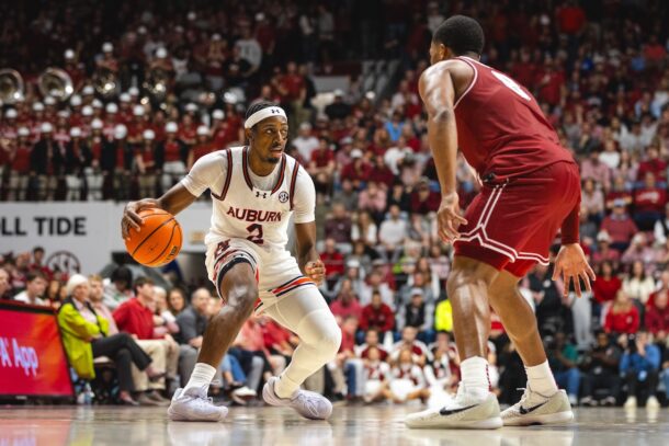 Auburn guard Denver Jones dribbles the ball during a game against Alabama.