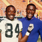 Sterling Sharpe and Shannon Sharpe before a game in 1990.