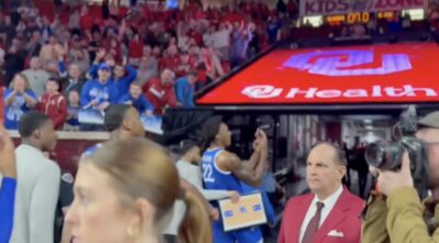 Kentucky players walk off the court after winning at Oklahoma.