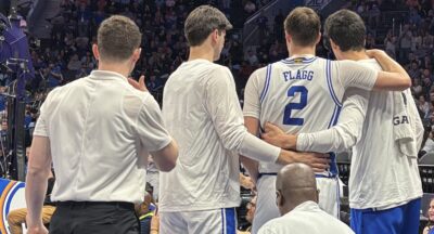 Cooper Flagg is helped off the floor after suffering an ankle injury against Georgia Tech in the ACC Tournament.