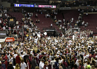 Florida State fans rush the court after beating Duke in 2022.
