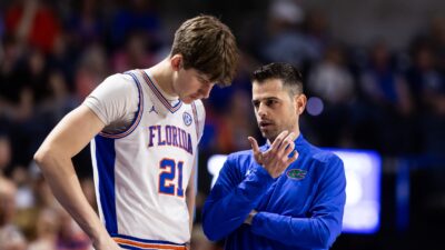 Florida's Alex Condon and head coach Todd Golden.
