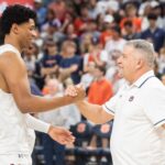 Bruce Pearl and Dylan Cardwell embrace.