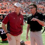 Brent Venables and Mike Gundy before a game.