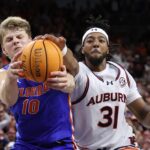 Thomas Haugh grabs a rebound against Auburn.