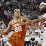 Tre Johnson of Texas drives to the lane against Arkansas.