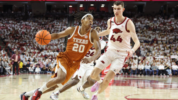 Tre Johnson drives the ball past Zvonimir Ivisic.