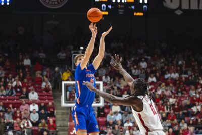 Alex Condon of Florida launches a shot over an Alabama defender.