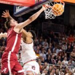 Grant Nelson dunks on an Auburn player.