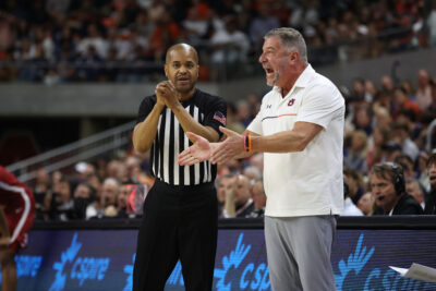 Bruce Pearl speaks to an official.