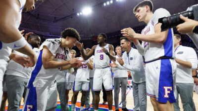 Florida players gather after win over Ole Miss.