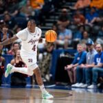 Wade Taylor dribbles the ball in the SEC Tournament.
