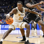 Mark Mitchell plays against Mississippi State in the SEC Tournament.