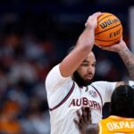 Auburn's Johni Broome holds the ball over his head during a game against Tennessee.