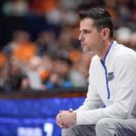 Todd Golden, Florida's coach, looks onto the court during a game against Tennessee.