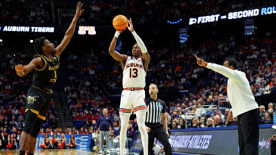 Miles Kelly shoots a 3-pointer.