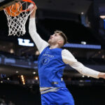 Kentucky's Andrew Carr warms up.