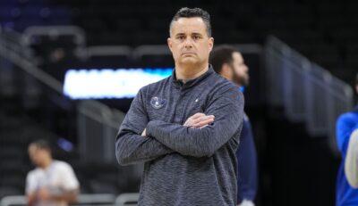 Xavier coach Sean Miller watches his team warm up for a game.