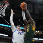 Alex Condon of Florida defends a dunk attempt against Norfolk State.