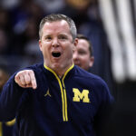 Michigan coach Dusty May.