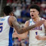 Walter Clayton Jr. and Will Richard celebrate Florida's win over UConn in the NCAA Tournament.