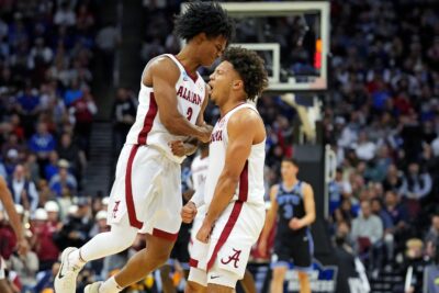 Mark Sears and teammates celebrate a made 3-pointer.
