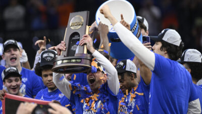 Florida players and coaches celebrate.