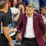 Nate Oats coaches during an NCAA Tournament game.