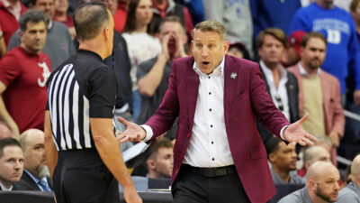 Nate Oats coaches during an NCAA Tournament game.