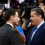 Rick Pitino and John Calipari talk before a game in 2016.