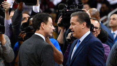 Rick Pitino and John Calipari talk before a game in 2016.
