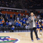 Billy Napier is shown at a Florida basketball game.