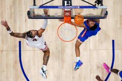 Auburn and Florida players battle for a rebound.