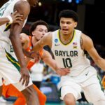 Baylor's RayJ Dennis (10) drives to the basket during the second round game between Clemson University and Baylor University in the 2024 NCAA Tournament at FedExForum in Memphis, Tenn., on Sunday, March 24, 2024.